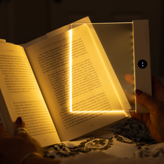 Light panel glowing warm over book pages