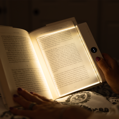 Lifestyle photo of the light panel over an open book