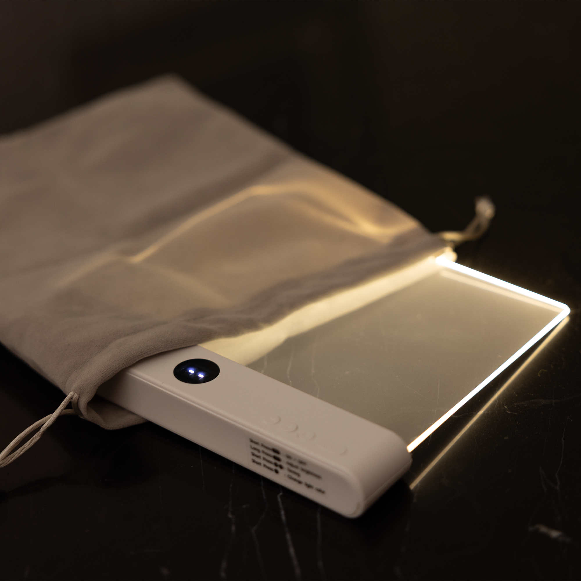 Light panel with soft glow in a dark room